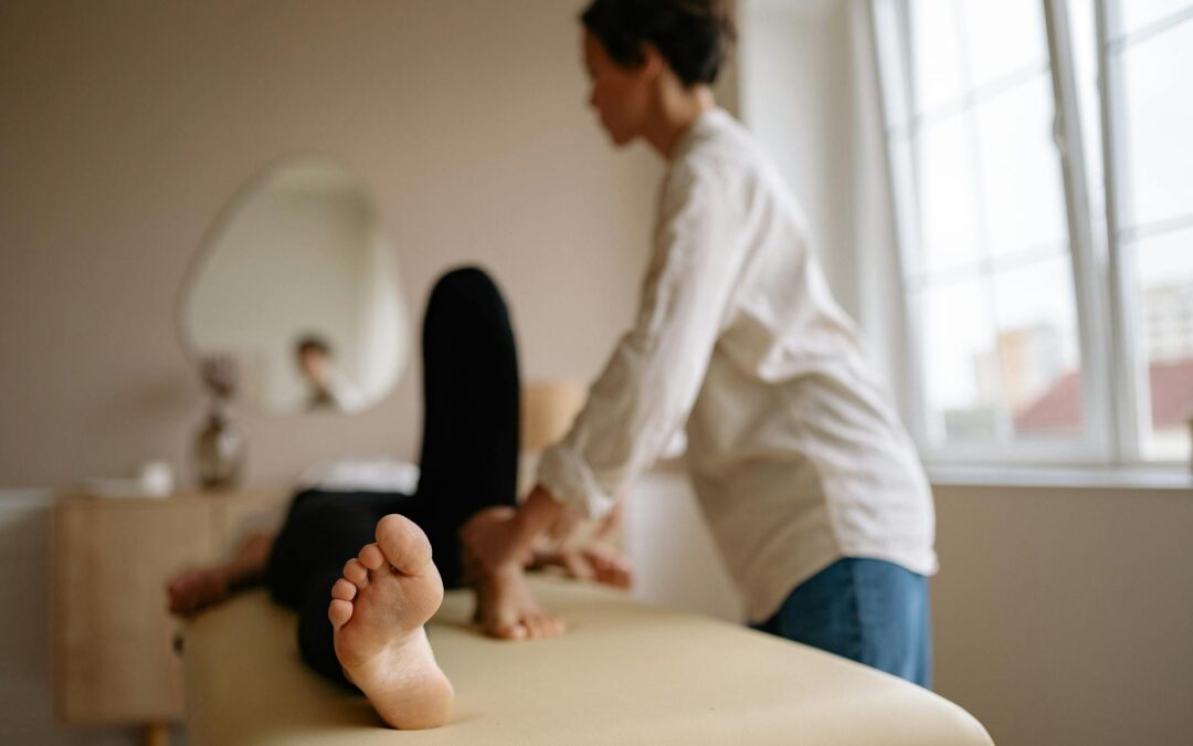A calming foot massage in a serene indoor spa environment with natural light.