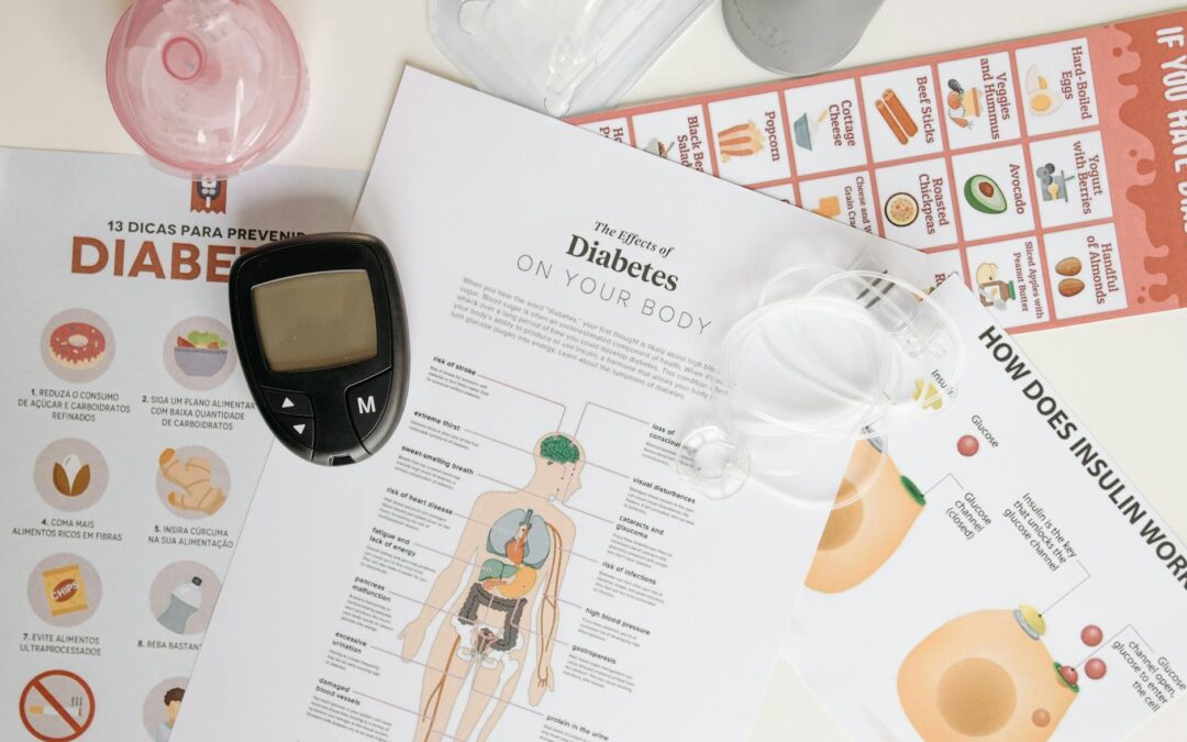 Close-up of diabetes management tools and informational documents on a table.